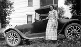 Euphemia Urben and auto in the drive of their Monticello home  on today's Urban Rd. Whoever named the village streets didn't  verify the spelling of the Urben family name before creating new street signs.</P